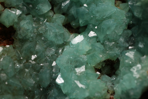 Closeup of Green Adamite raw crystal on Goethite matrix