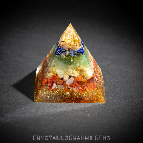 Orgonite Pyramid containing multiple layers of crystals to symbolize the chakras